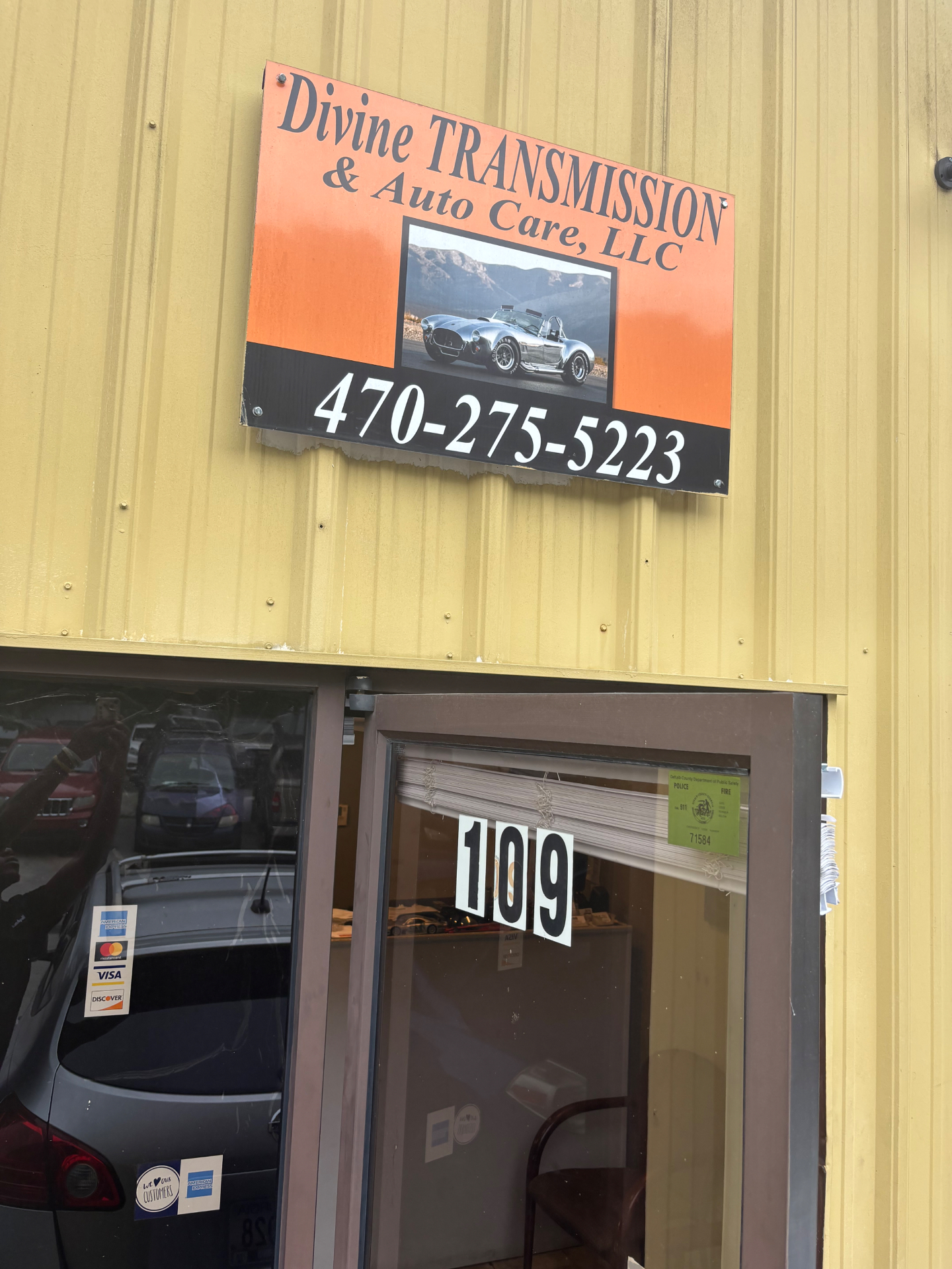 Divine Transmission & Auto Care storefront sign in Conyers, GA